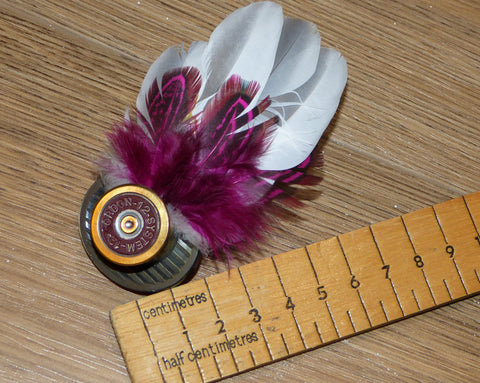 Feather Brooch or Hat Pin set in cartridge case head.
